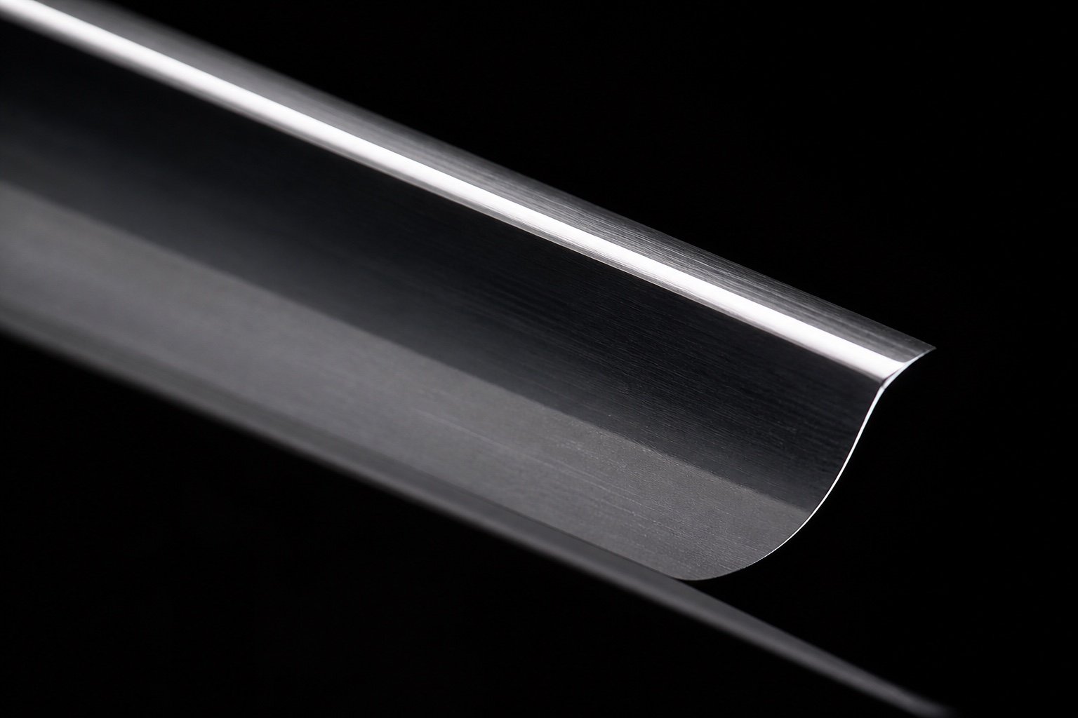 Macro chrome straight razor edge on black glass
